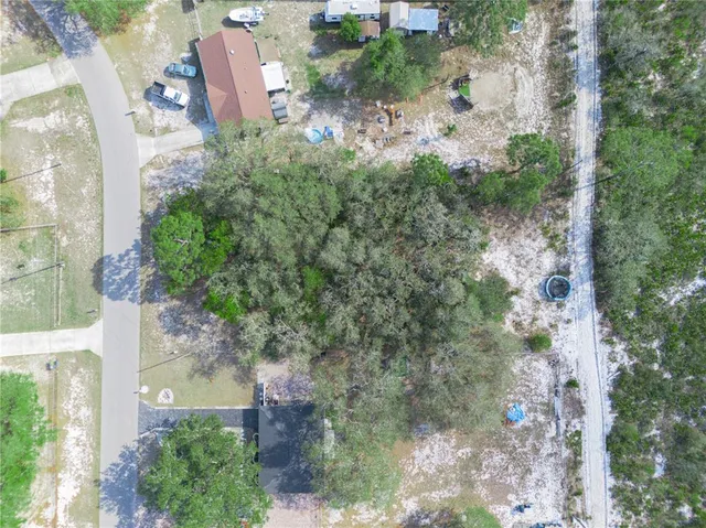 an aerial view of residential house with outdoor space