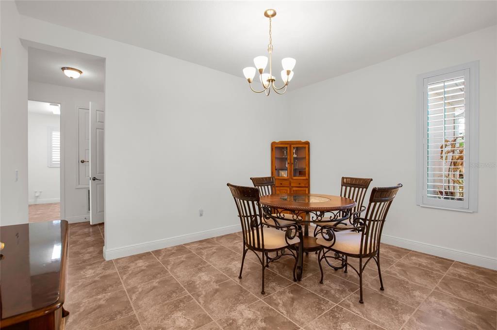531 Villa Park Road Kissimmee, FL 34759 - Photo 12 of 63 a view of a dining room with furniture and chandelier