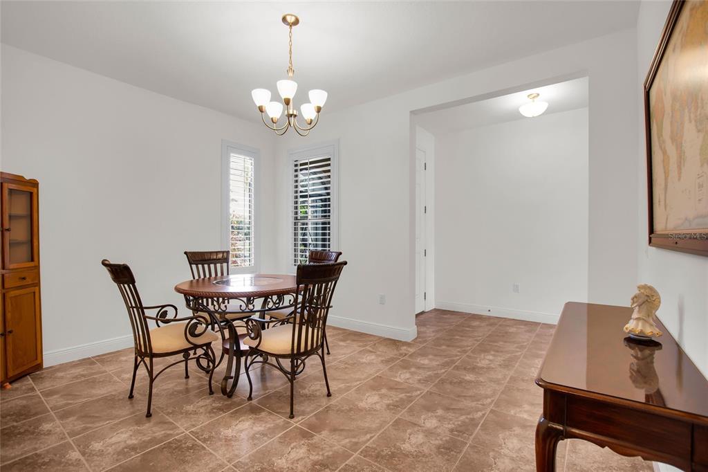 531 Villa Park Road Kissimmee, FL 34759 - Photo 14 of 63 a view of a dining room with furniture and chandelier