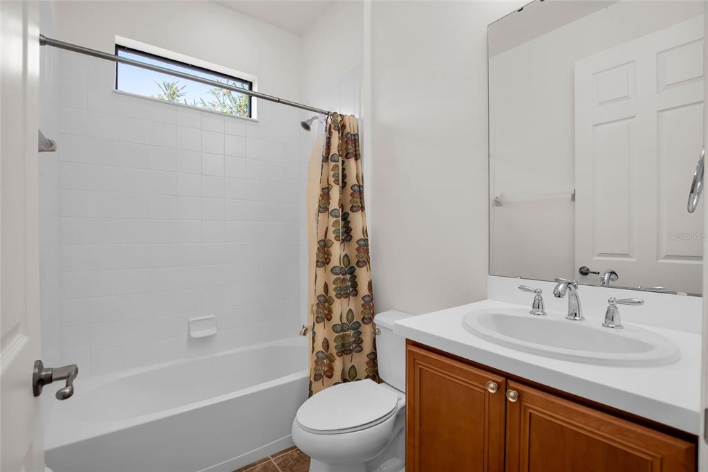 531 Villa Park Road Kissimmee, FL 34759 - Photo 15 of 63 a bathroom with a sink a toilet and shower