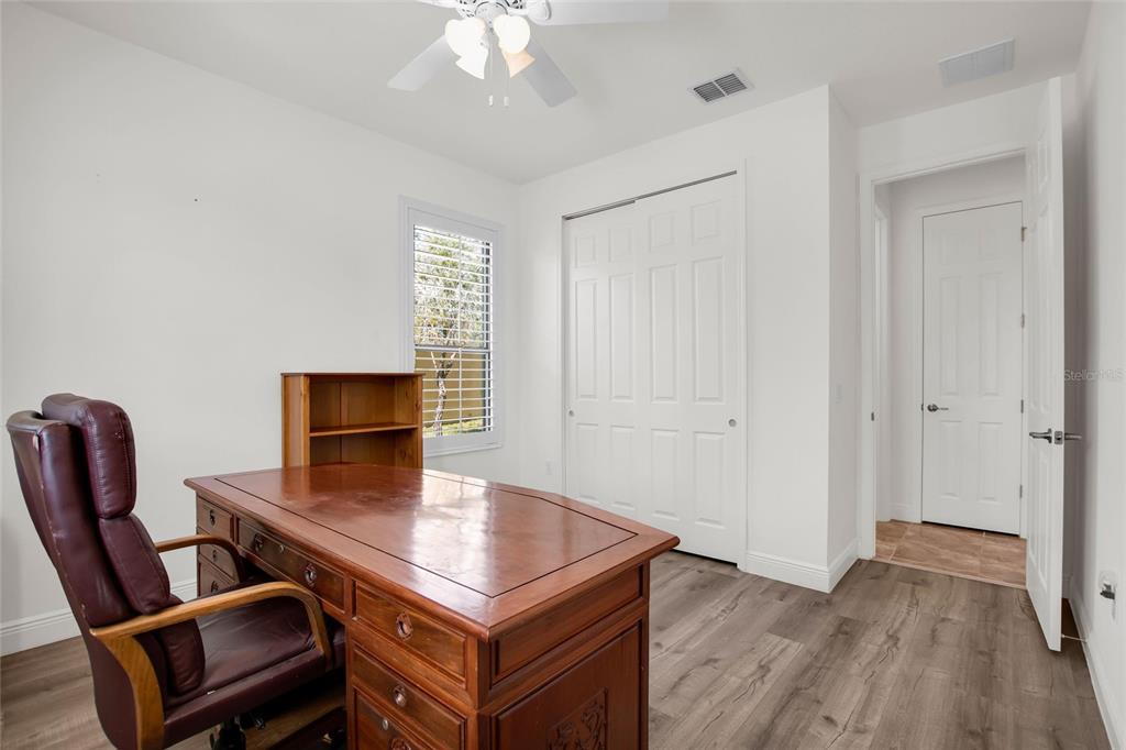 531 Villa Park Road Kissimmee, FL 34759 - Photo 17 of 63 a view of a workspace with furniture and wooden floor
