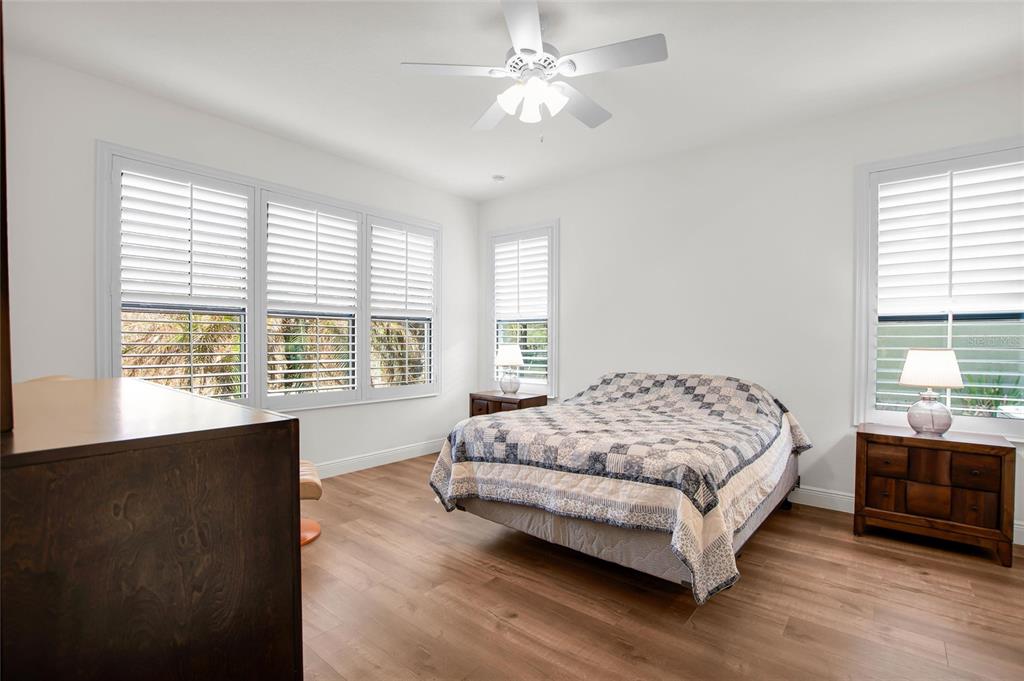 531 Villa Park Road Kissimmee, FL 34759 - Photo 18 of 63 a bedroom with a bed a dresser next to a window