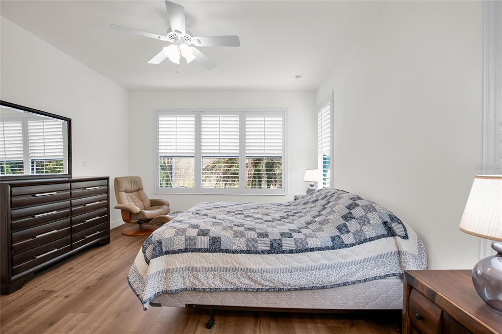 531 Villa Park Road Kissimmee, FL 34759 - Photo 20 of 63 a bedroom with a bed and a chandelier