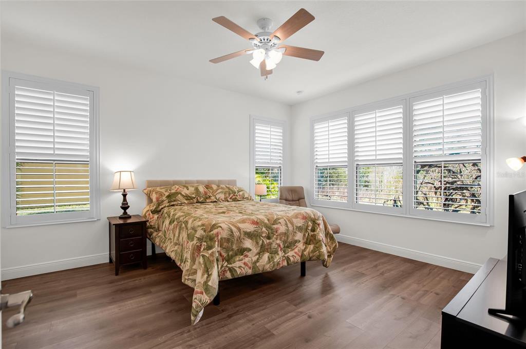 531 Villa Park Road Kissimmee, FL 34759 - Photo 23 of 63 a bed sitting in a bedroom next to a window