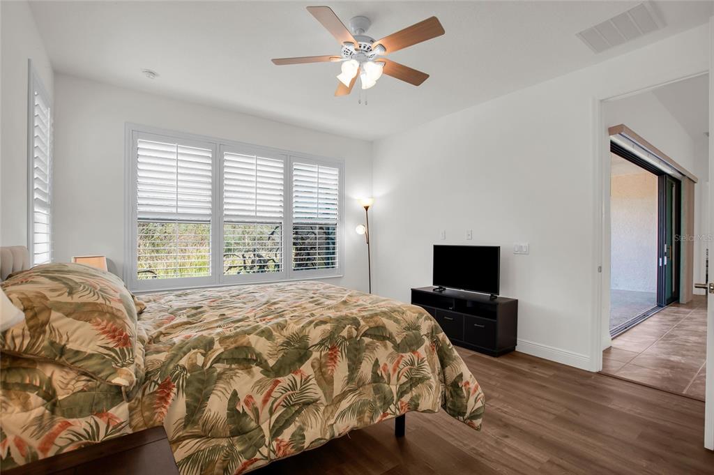 531 Villa Park Road Kissimmee, FL 34759 - Photo 25 of 63 a bedroom with a bed television on desk and a window