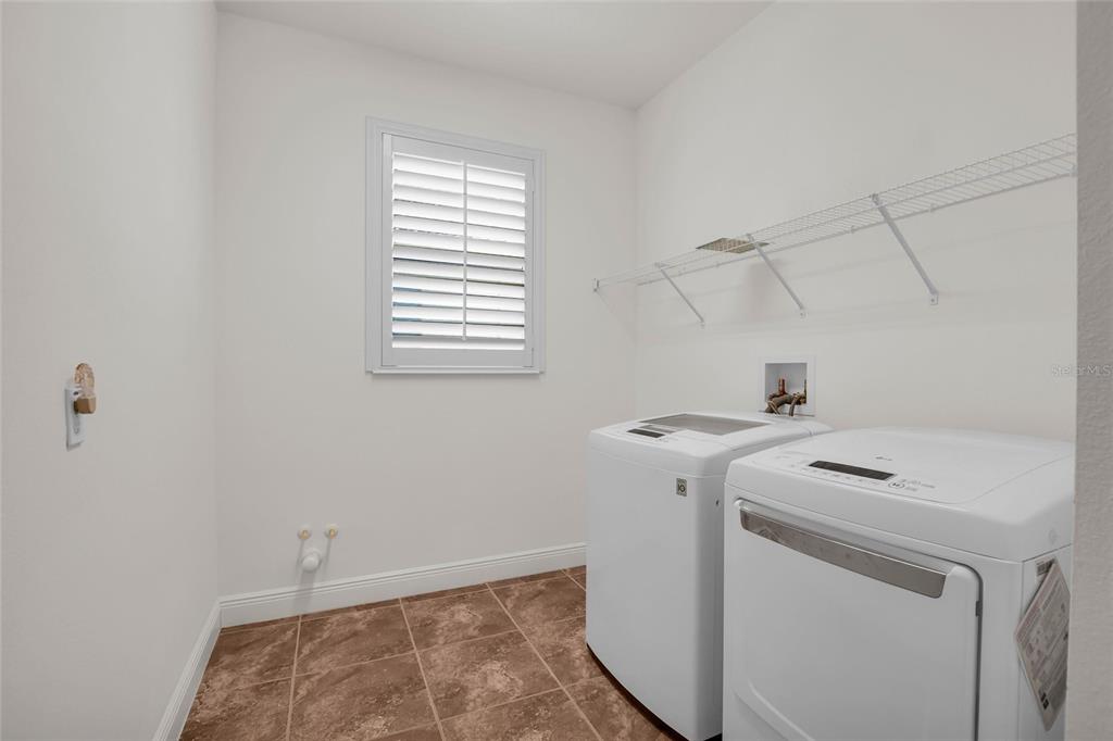 531 Villa Park Road Kissimmee, FL 34759 - Photo 28 of 63 a utility room with dryer and washer