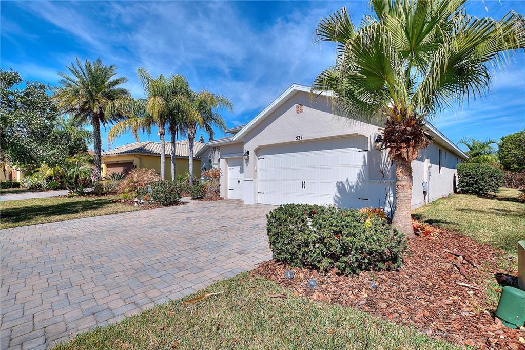 531 Villa Park Road Kissimmee, FL 34759 - Photo 35 of 63 a front view of a house with a yard and garage