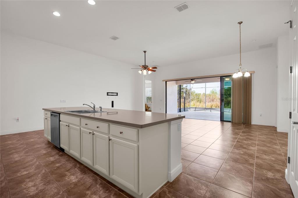 531 Villa Park Road Kissimmee, FL 34759 - Photo 4 of 63 a spacious bathroom with a granite countertop sink a mirror and a bathtub
