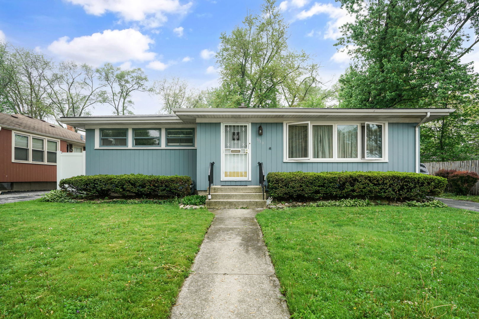 1110 Olive Road Homewood, IL 60430 - Photo 1 of 16 a front view of a house with a garden