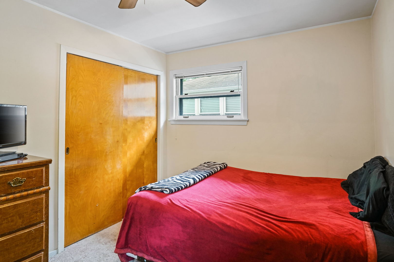 1110 Olive Road Homewood, IL 60430 - Photo 8 of 16 a bedroom with a bed and a flat tv screen
