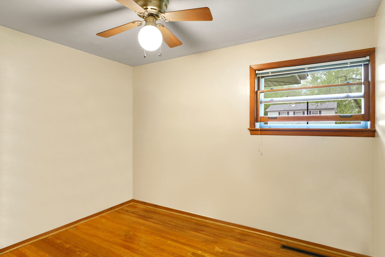 1110 Olive Road Homewood, IL 60430 - Photo 9 of 16 a view of empty room with wooden floor and fan