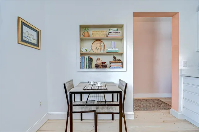 a dining room with furniture and window