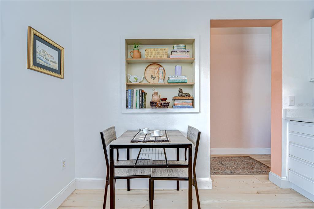 2139 Elm Street, Unit 308 Dunedin, FL 34698 - Photo 12 of 46 a dining room with furniture and window