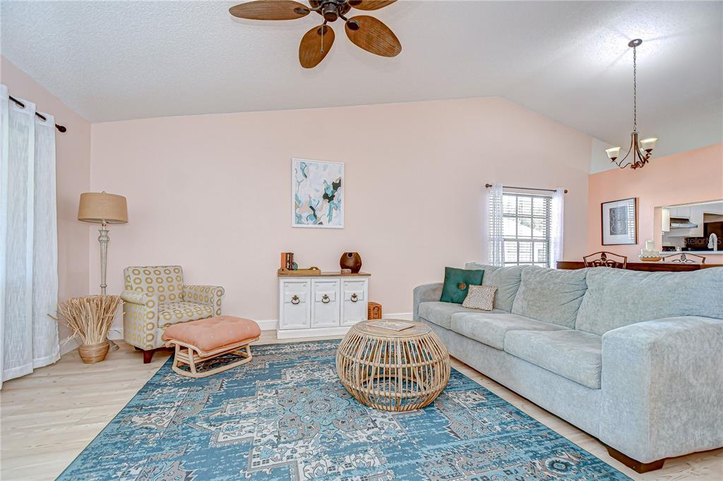 2139 Elm Street, Unit 308 Dunedin, FL 34698 - Photo 16 of 46 a living room with furniture rug and window