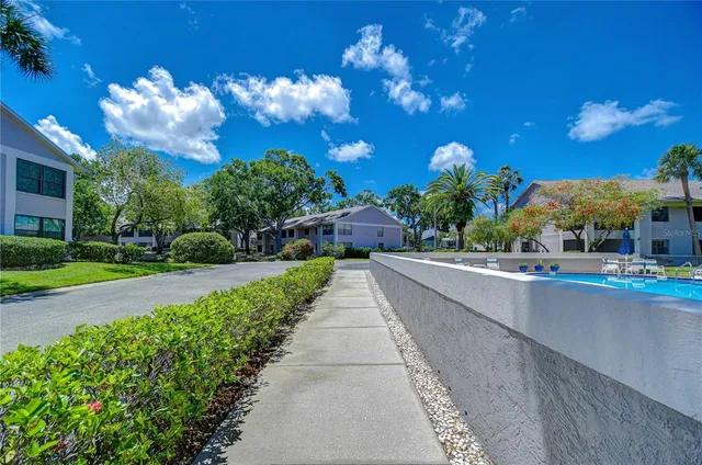 a view of a street with a building in the background