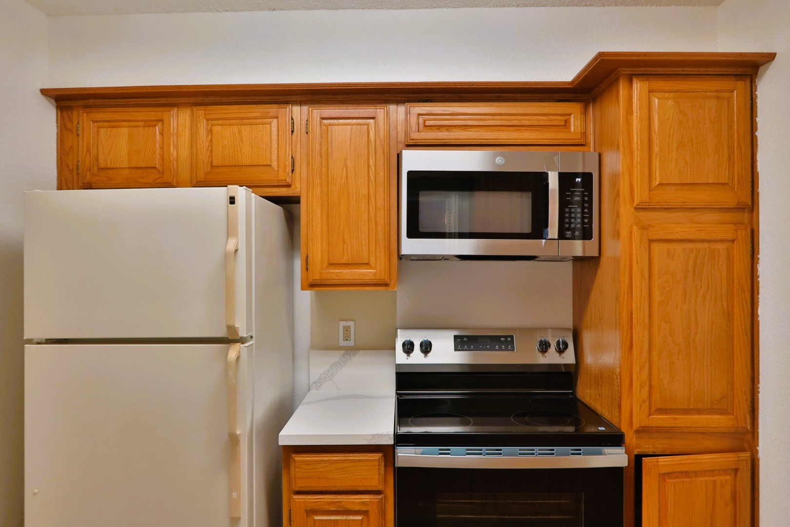 1311 Antoine Drive, Unit 251 Houston, TX 77055 - Photo 16 of 30 a kitchen with a refrigerator and a stove