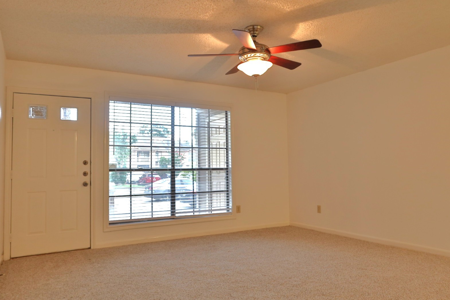 1311 Antoine Drive, Unit 251 Houston, TX 77055 - Photo 3 of 30 an empty room with windows and fan