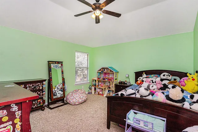 a bed room with furniture and a window