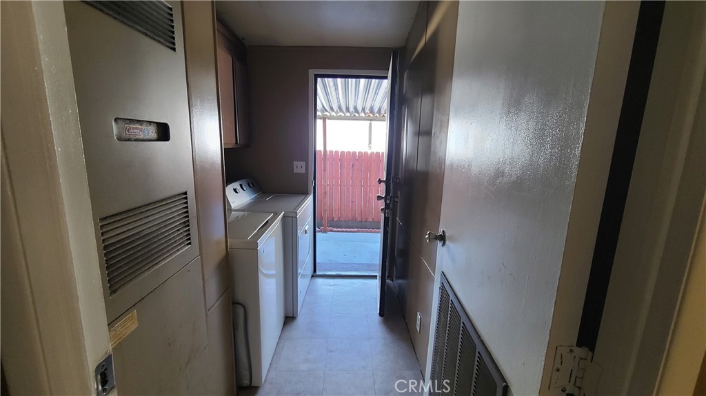4080 Pedley Road, Unit 49 Jurupa Valley, CA 92509 - Photo 7 of 15 a hallway with a washer and dryer