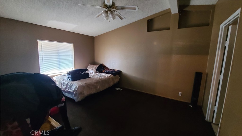 4080 Pedley Road, Unit 49 Jurupa Valley, CA 92509 - Photo 8 of 15 a bedroom with a bed and a window