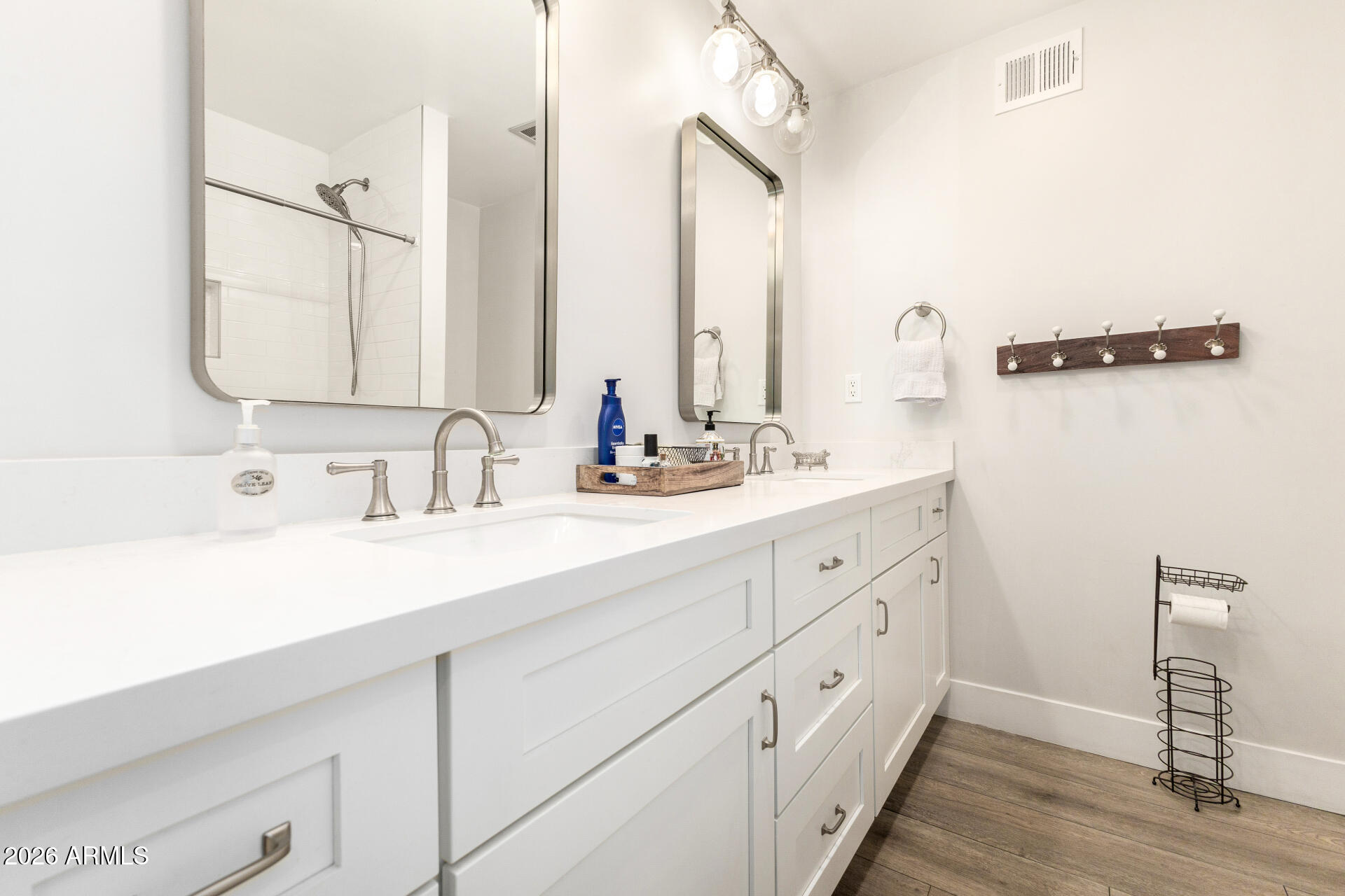 11044 North 36th Street Phoenix, AZ 85028 - Photo 27 of 62 a bathroom with double vanity sink and a mirror