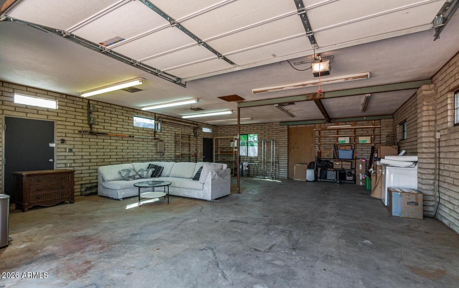 11044 North 36th Street Phoenix, AZ 85028 - Photo 33 of 62 a living room with furniture and a flat screen tv