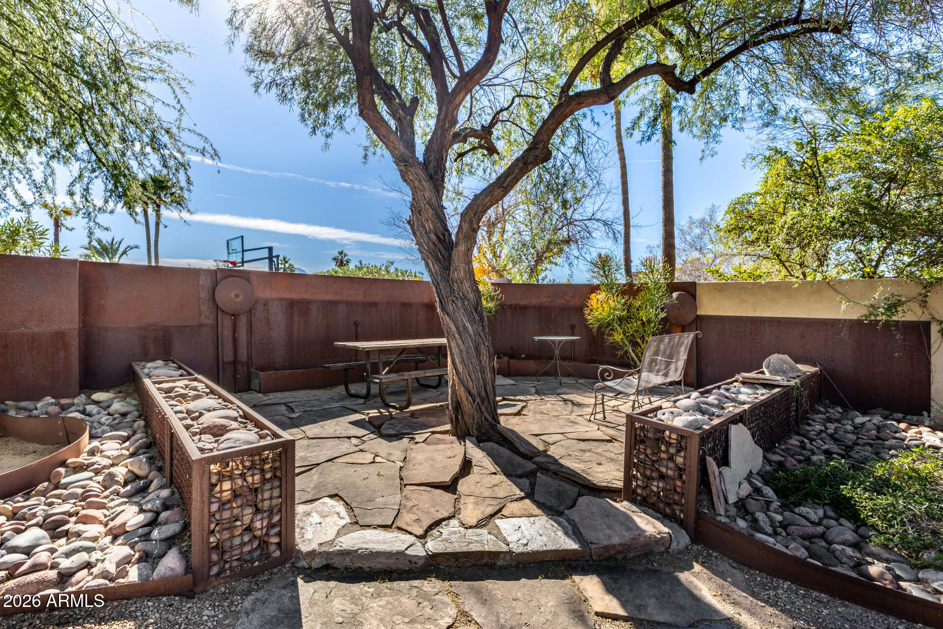 11044 North 36th Street Phoenix, AZ 85028 - Photo 37 of 62 a view of a backyard with furniture and a fire pit