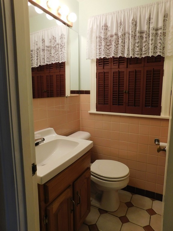 672 Amostown Road West Springfield, MA 01089 - Photo 19 of 30 a bathroom with a sink a toilet and shower
