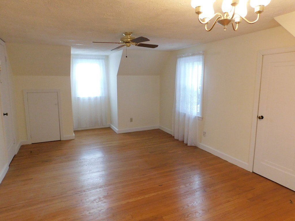 672 Amostown Road West Springfield, MA 01089 - Photo 20 of 30 an empty room with wooden floor and windows