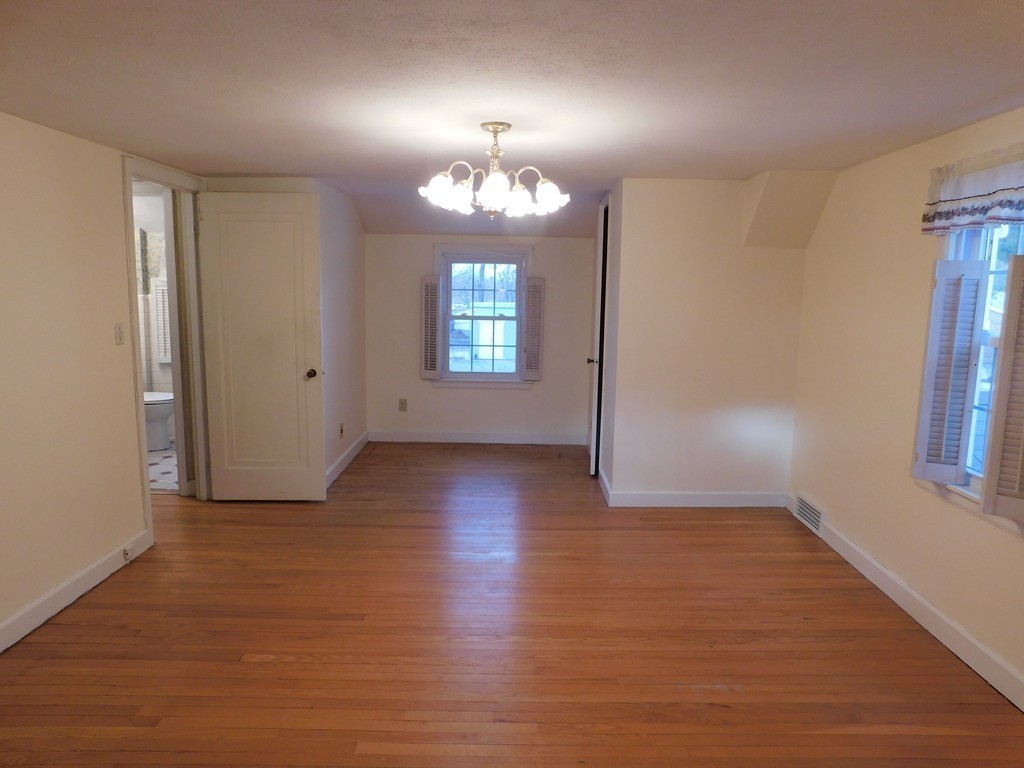 672 Amostown Road West Springfield, MA 01089 - Photo 22 of 30 an empty room with wooden floor and windows