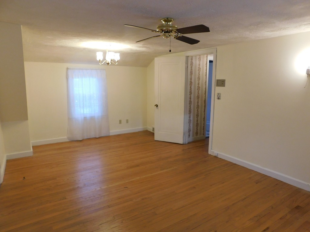 672 Amostown Road West Springfield, MA 01089 - Photo 23 of 30 an empty room with wooden floor and windows