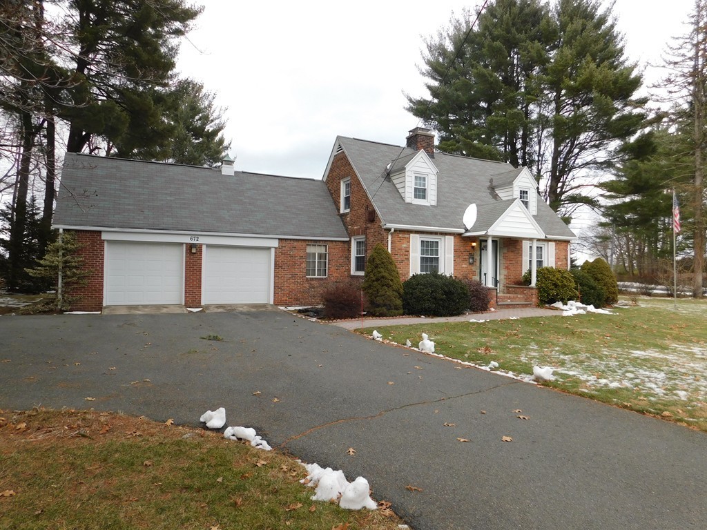 672 Amostown Road West Springfield, MA 01089 - Photo 30 of 30 a front view of a house with a yard and garage