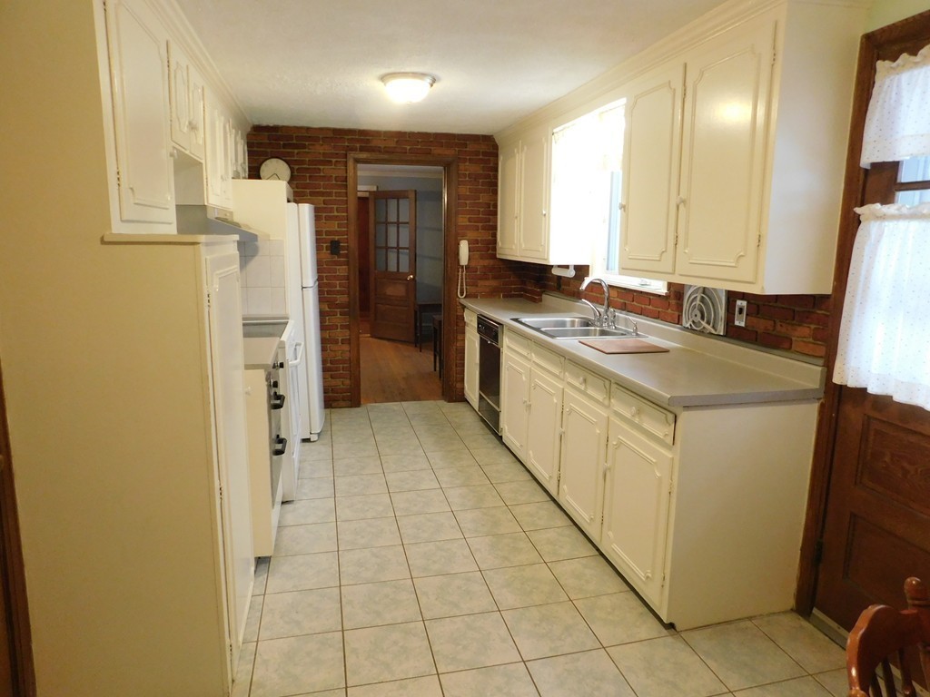 672 Amostown Road West Springfield, MA 01089 - Photo 10 of 30 a large bathroom with a sink a mirror and a bathtub