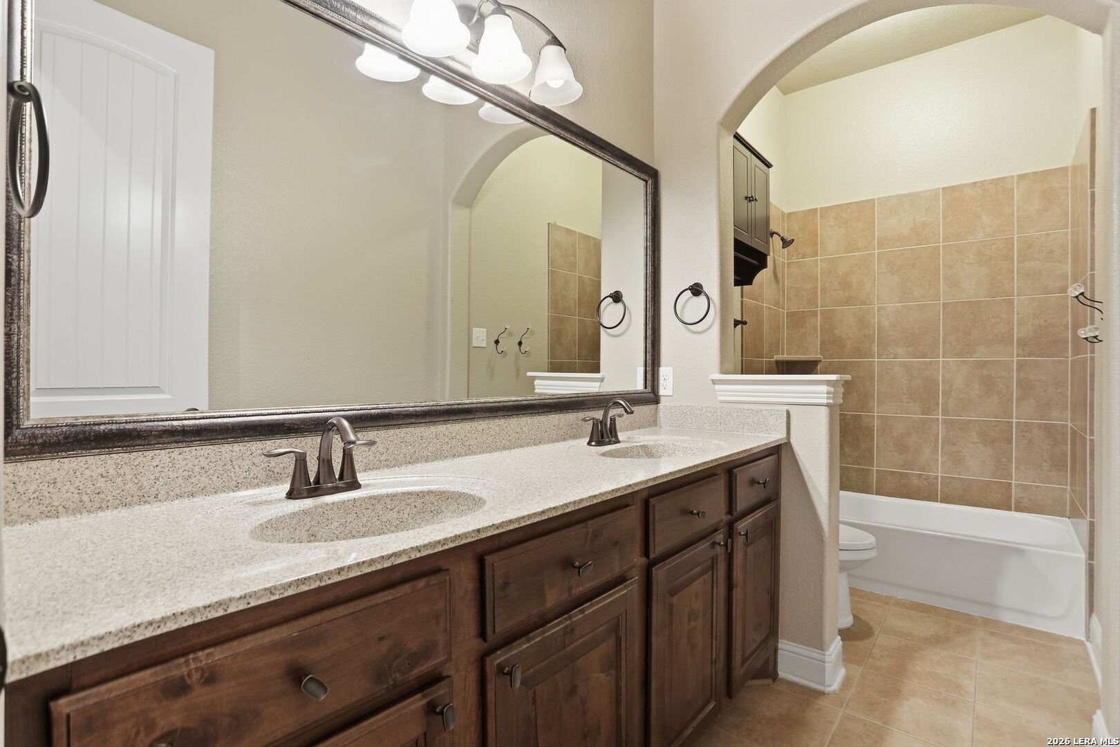 27003 Hardy Run Boerne, TX 78015 - Photo 12 of 17 a bathroom with a granite countertop sink and a mirror