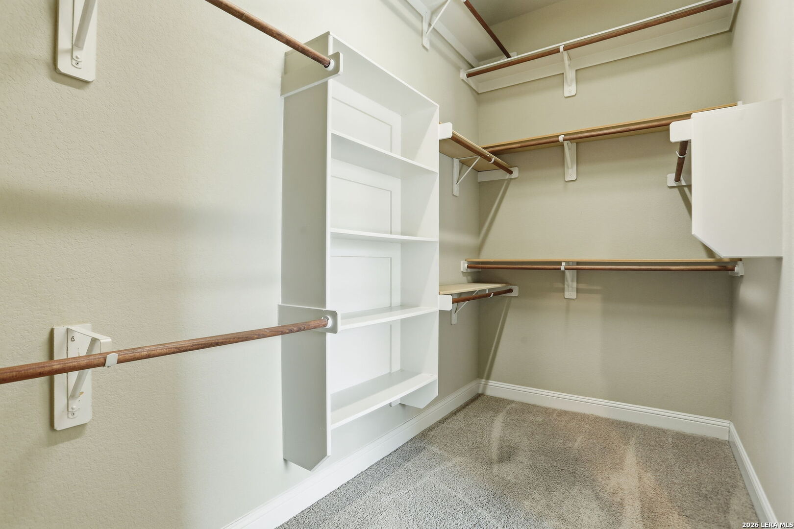 27003 Hardy Run Boerne, TX 78015 - Photo 14 of 17 a view of walk in closet with empty racks