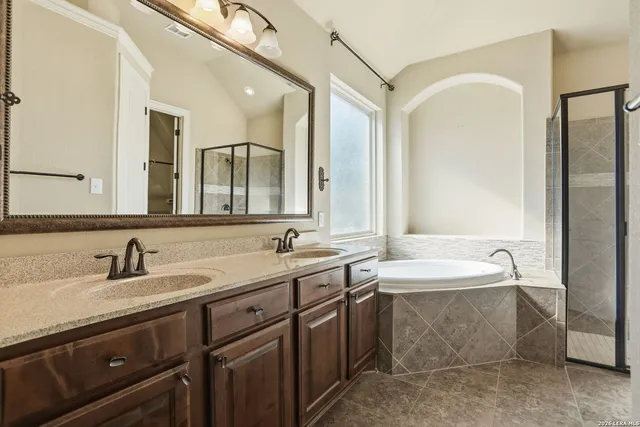 a bathroom with a double vanity sink mirror and double