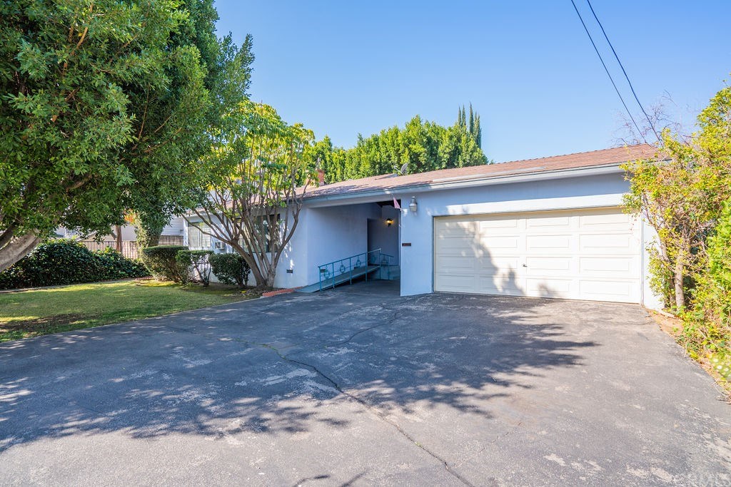 1025 La Cadena Avenue Arcadia, CA 91007 - Photo 5 of 43 Two car garage along with a 3 car driveway and carport offer plenty of storage and parking.