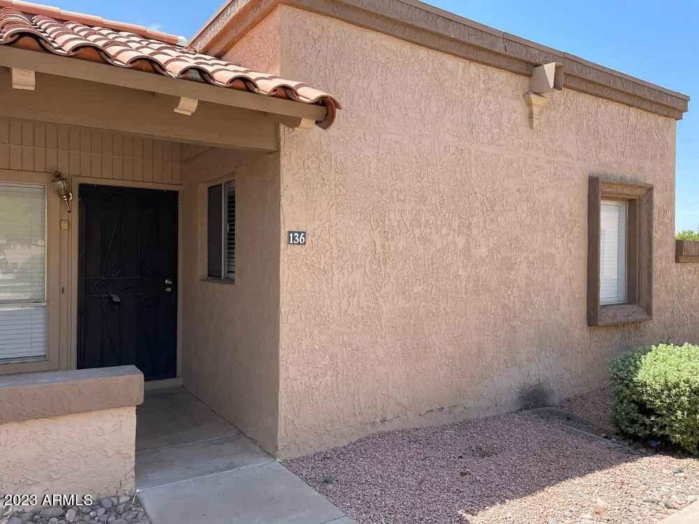 99 North Cooper Road, Unit 136 Chandler, AZ 85225 - Photo 1 of 14 a view of a house with a small porch