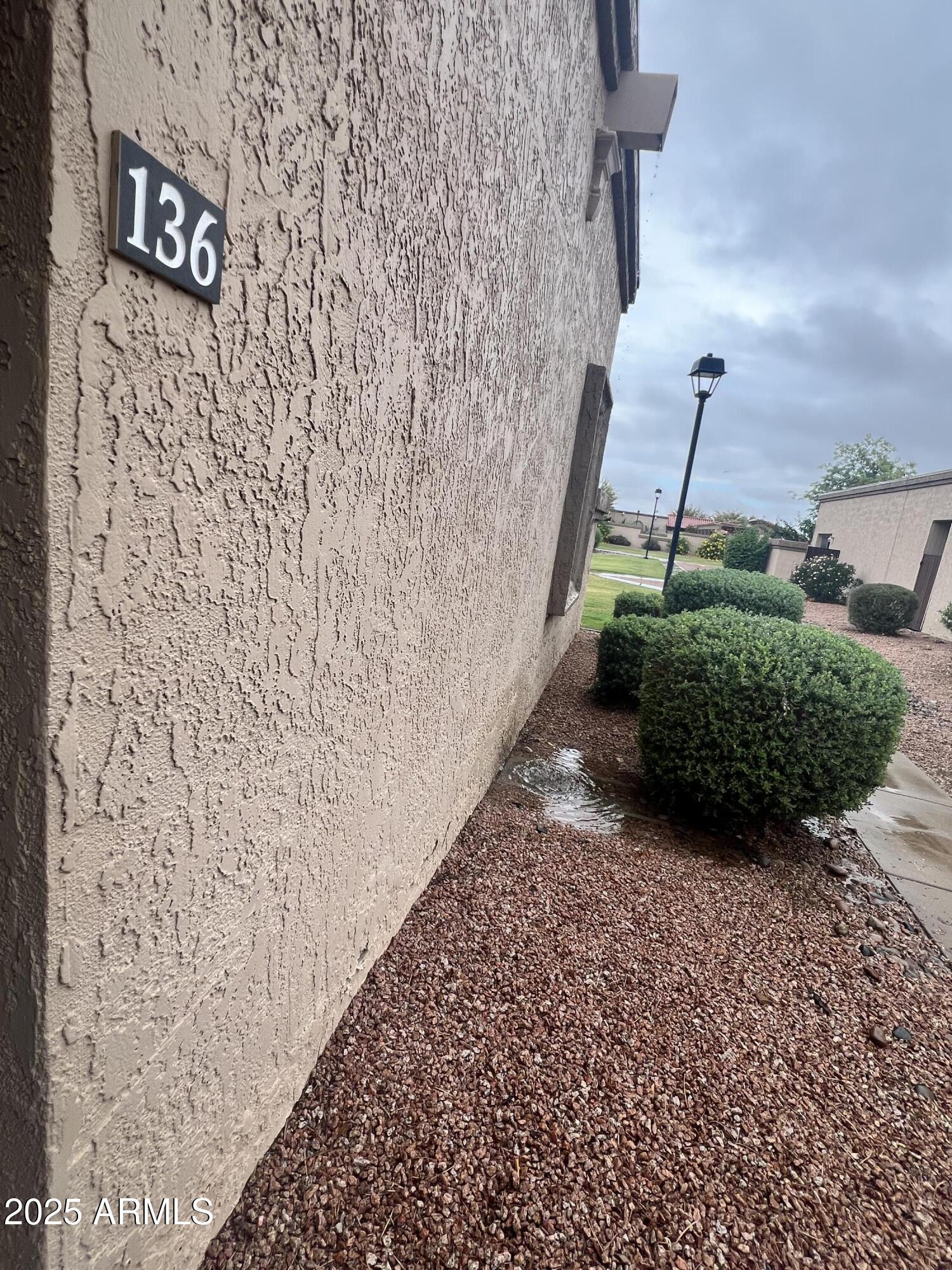99 North Cooper Road, Unit 136 Chandler, AZ 85225 - Photo 13 of 14 a view of a pathway of a building
