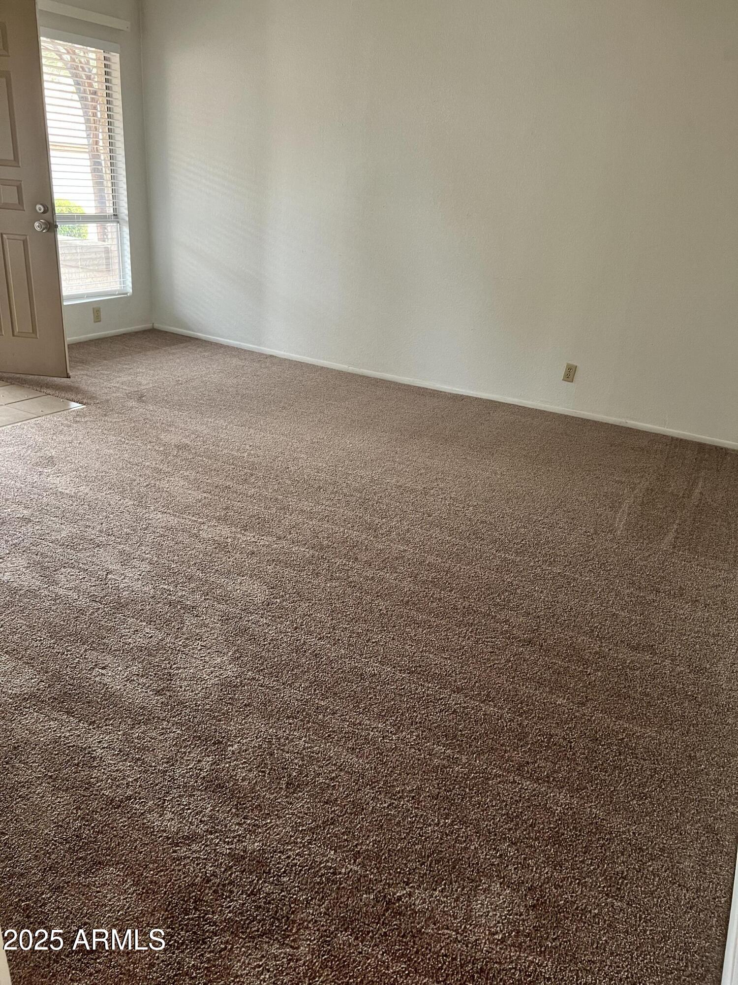 99 North Cooper Road, Unit 136 Chandler, AZ 85225 - Photo 4 of 14 an empty room with a window