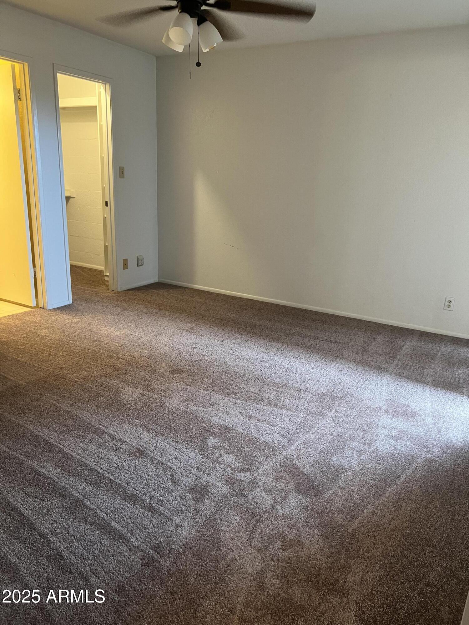 99 North Cooper Road, Unit 136 Chandler, AZ 85225 - Photo 8 of 14 a view of empty room with windows