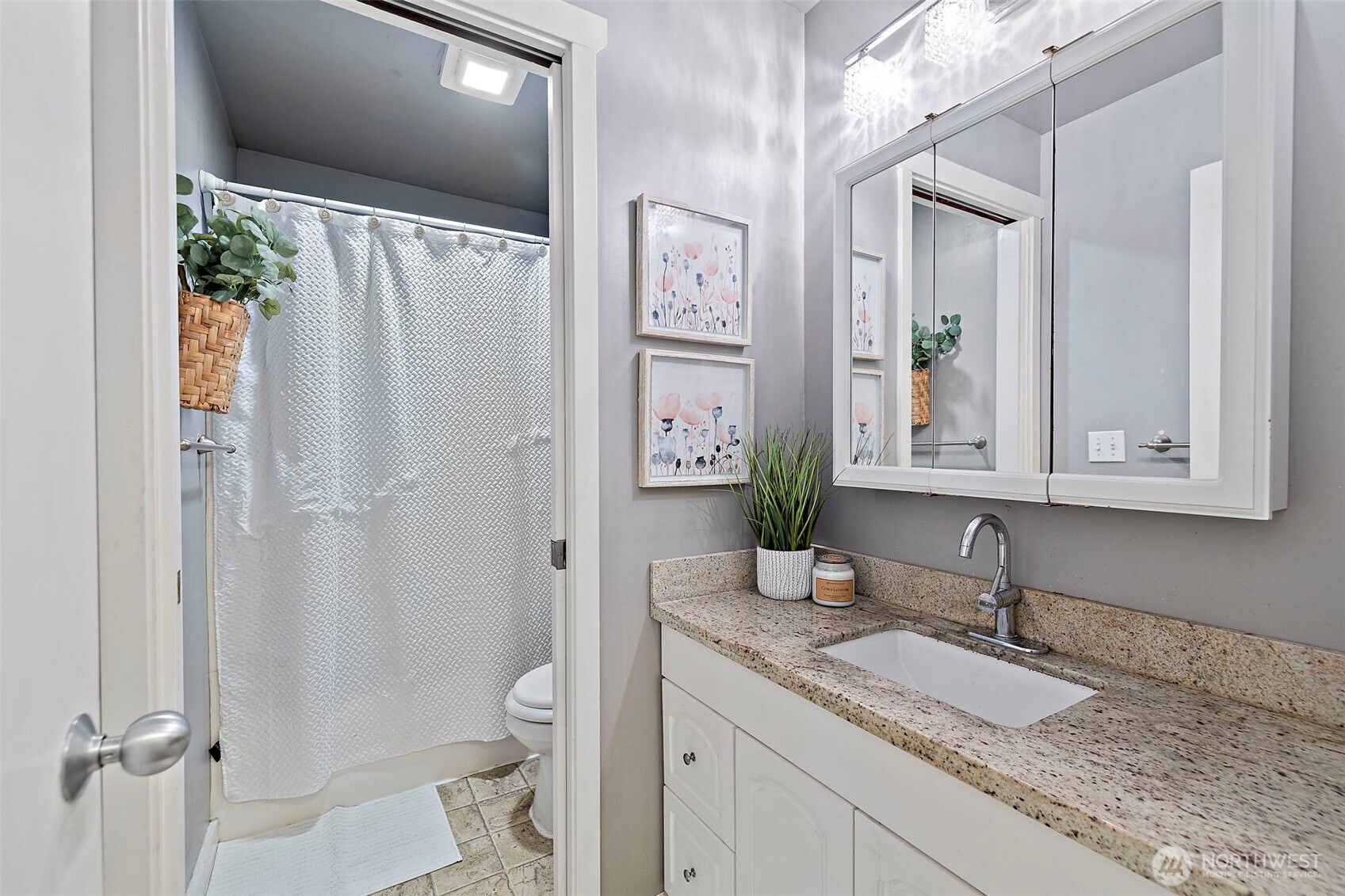 19401 Southeast 267th Street Covington, WA 98042 - Photo 13 of 31 a bathroom with a granite countertop sink and a mirror