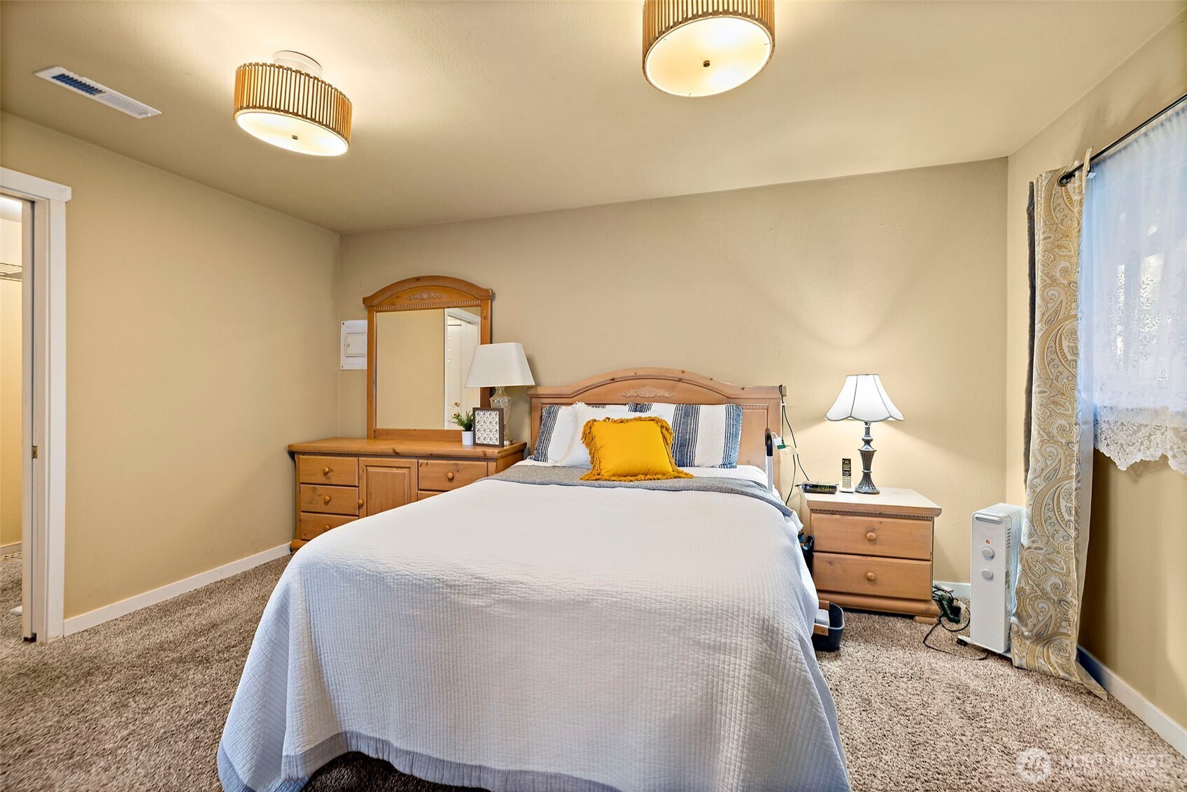 19401 Southeast 267th Street Covington, WA 98042 - Photo 17 of 31 a bedroom with a bed and a lamp