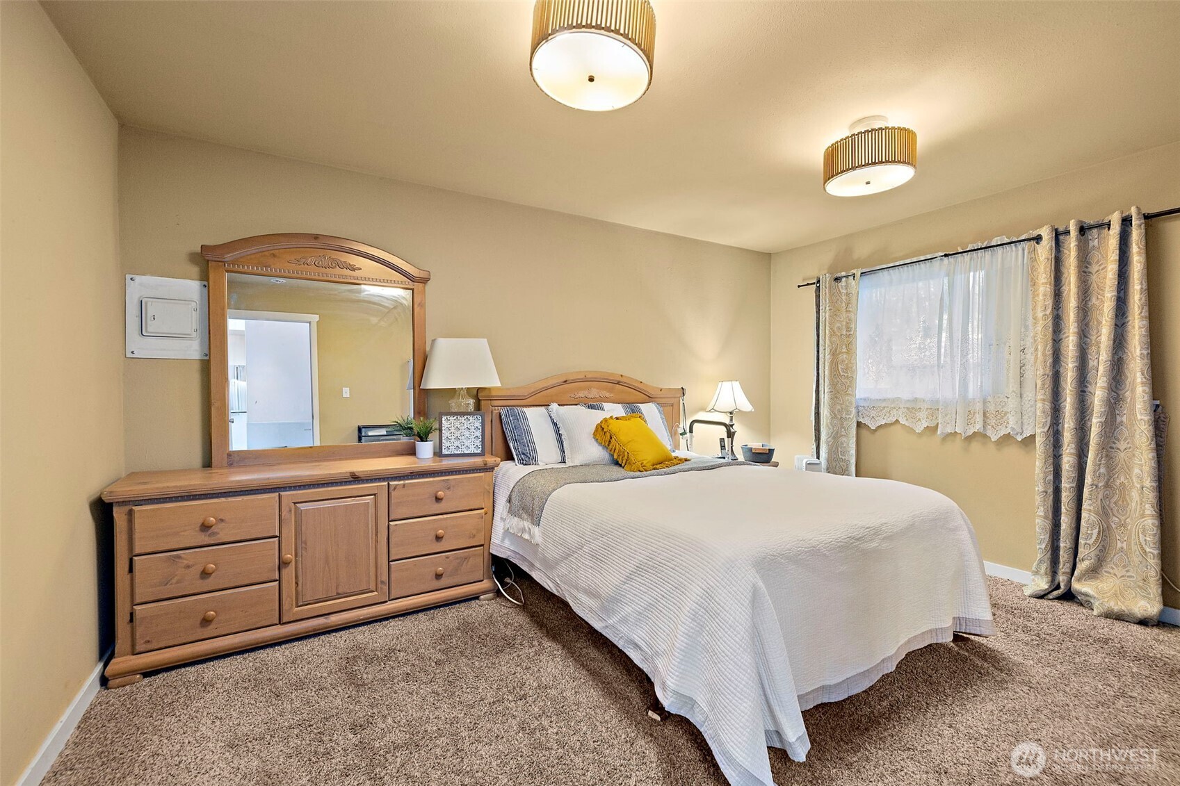 19401 Southeast 267th Street Covington, WA 98042 - Photo 18 of 31 a bedroom with a bed and a dresser