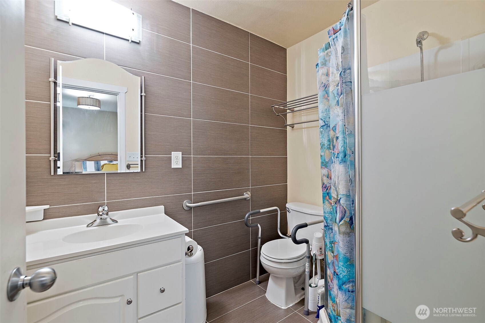 19401 Southeast 267th Street Covington, WA 98042 - Photo 19 of 31 a bathroom with a sink toilet and shower