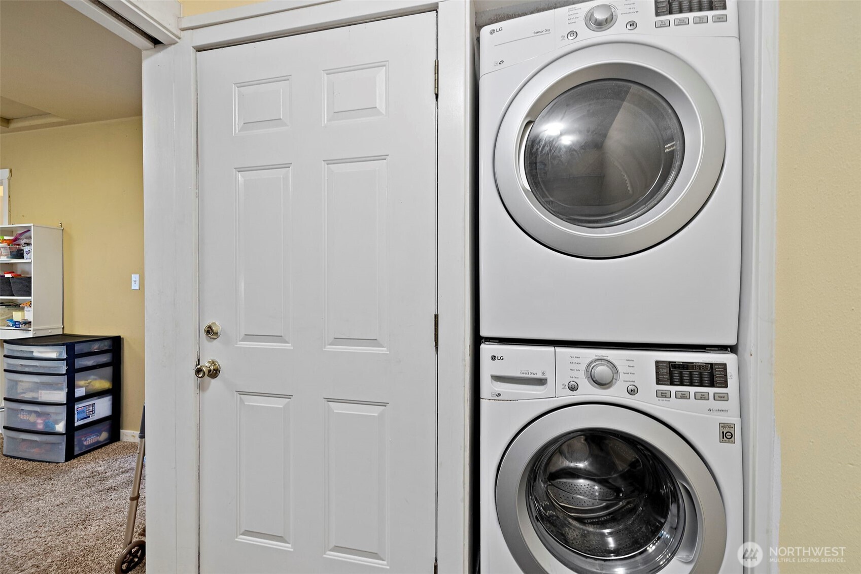 19401 Southeast 267th Street Covington, WA 98042 - Photo 20 of 31 a view of a hallway with washer and dryer