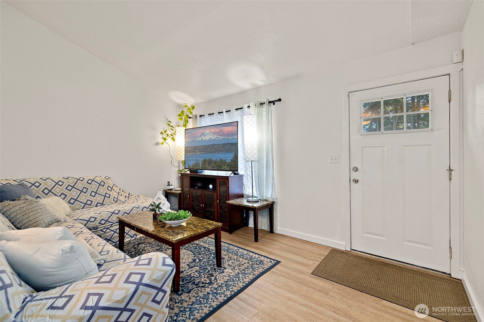 19401 Southeast 267th Street Covington, WA 98042 - Photo 2 of 31 a living room with furniture and a rug