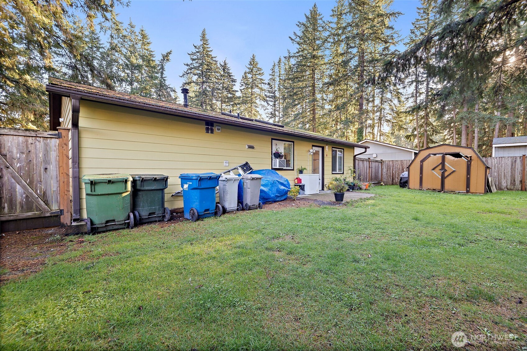 19401 Southeast 267th Street Covington, WA 98042 - Photo 23 of 31 a view of a house with backyard and sitting area