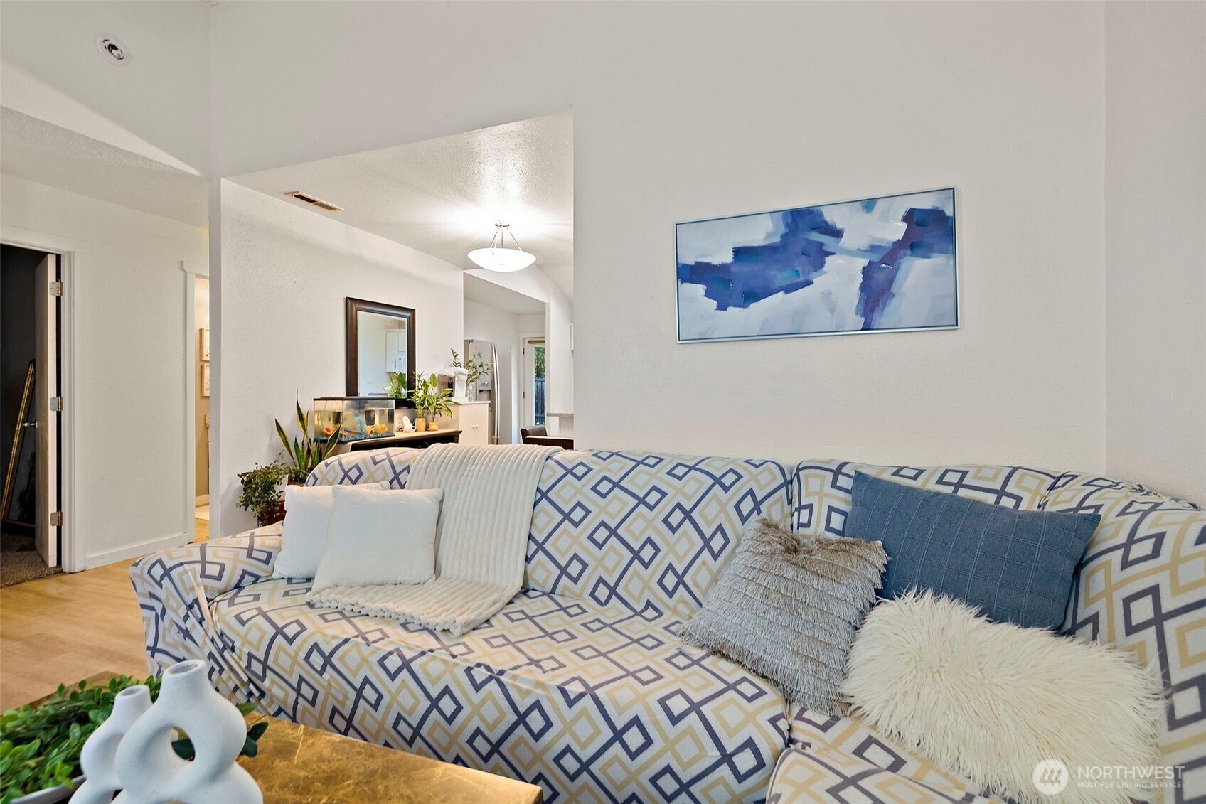 19401 Southeast 267th Street Covington, WA 98042 - Photo 3 of 31 a bedroom with a bed and a couch