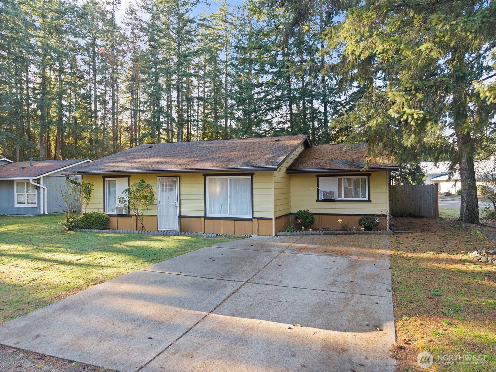 19401 Southeast 267th Street Covington, WA 98042 - Photo 31 of 31 a view of a house with a yard and large tree